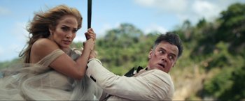 Movie still from “Shotgun Wedding” (2022), directed by Jason Moore – A man and a woman are fighting with a sword; Medium shot, Low angle