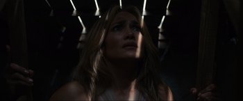 Movie still from “Shotgun Wedding” (2022), directed by Jason Moore – A person with long brown hair; Close Up shot, Overhead angle