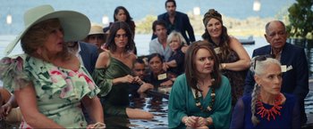 Movie still from “Shotgun Wedding” (2022), directed by Jason Moore – A group of people sitting in a body of water; Wide shot, High angle