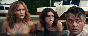 Movie still from “Shotgun Wedding” (2022), directed by Jason Moore – Two women are sitting in a pool of water; Close Up shot, High angle