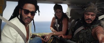 Movie still from “Shotgun Wedding” (2022), directed by Jason Moore – A man and a woman sitting in the back of a car; Medium shot, Over the shoulder angle