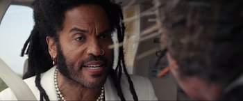 Movie still from “Shotgun Wedding” (2022), directed by Jason Moore – A person with dreadlocks; Close Up shot, Over the shoulder angle