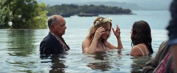 Movie still from “Shotgun Wedding” (2022), directed by Jason Moore – A man and a woman in a body of water; Medium shot, Over the shoulder angle