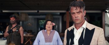 Movie still from “Shotgun Wedding” (2022), directed by Jason Moore – A man and a woman standing next to each other; Medium shot, Over the shoulder angle