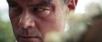 Movie still from “Shotgun Wedding” (2022), directed by Jason Moore – A man's face with a bruise on it's forehead; Extreme Close Up shot, Low angle