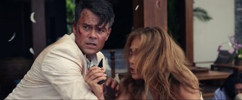 Movie still from “Shotgun Wedding” (2022), directed by Jason Moore – A man and a woman are holding a knife; Close Up shot, Over the shoulder angle