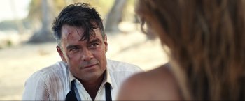 Movie still from “Shotgun Wedding” (2022), directed by Jason Moore – A person wearing a shirt and tie; Close Up shot, Over the shoulder angle