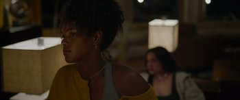 Movie still from “Sick” (2022), directed by John Hyams – A woman in a yellow shirt is looking at a woman in a yellow shirt; Close Up shot, Over the shoulder angle