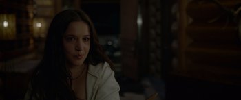 Movie still from “Sick” (2022), directed by John Hyams – A young woman sitting in front of a mirror; Close Up shot, Over the shoulder angle