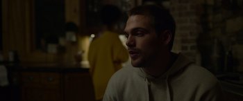 Movie still from “Sick” (2022), directed by John Hyams – A person in a room; Close Up shot, Over the shoulder angle