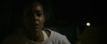 Movie still from “Sick” (2022), directed by John Hyams – A person wearing a hoodie; Close Up shot, Over the shoulder angle