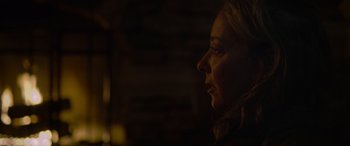 Movie still from “Sick” (2022), directed by John Hyams – A person's face in the dark; Close Up shot, Over the shoulder angle