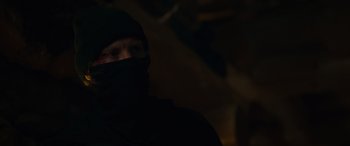 Movie still from “Sick” (2022), directed by John Hyams – A man wearing a black mask and a black head covering; Close Up shot, Over the shoulder angle