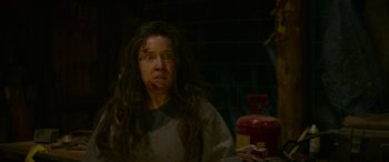 Movie still from “Sick” (2022), directed by John Hyams – A woman with a bandage on her face; Close Up shot, Low angle