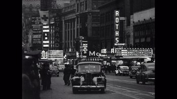 Movie still from “Sidney” (2022), directed by Reginald Hudlin – A black and white photo of a busy city street; Extreme Wide shot, High angle