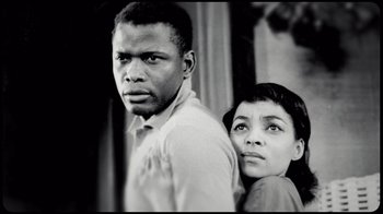 Movie still from “Sidney” (2022), directed by Reginald Hudlin – A man and a woman standing next to each other; Close Up shot, Low angle
