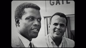 Movie still from “Sidney” (2022), directed by Reginald Hudlin – A black - and - white photo of two men standing next to each other; Close Up shot, Low angle