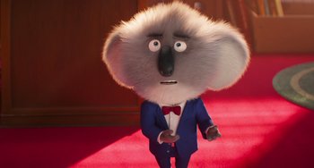 Movie still from “Sing 2” (2021), directed by Christophe Lourdelet – A cartoon character with a fur coat and a red bow tie; Close Up shot, Low angle