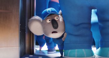Movie still from “Sing 2” (2021), directed by Christophe Lourdelet – A koala wearing a blue hat; Close Up shot, Over the shoulder angle
