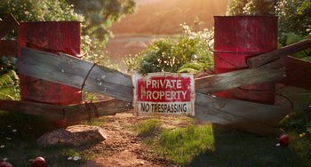 Movie still from “Sing 2” (2021), directed by Christophe Lourdelet – A sign that says " private property no tresspassing "; Extreme Wide shot, High angle