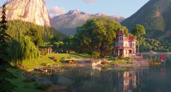 Movie still from “Sing 2” (2021), directed by Christophe Lourdelet – A house sitting next to a body of water with mountains in the background; Extreme Wide shot, High angle