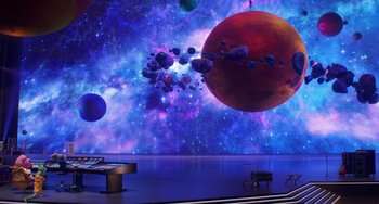 Movie still from “Sing 2” (2021), directed by Christophe Lourdelet – A projection of planets in a room with a pool table; Extreme Wide shot, High angle