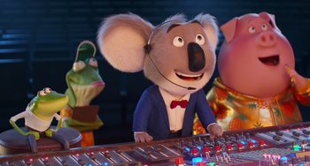 Movie still from “Sing 2” (2021), directed by Christophe Lourdelet – A cartoon mouse wearing a blue suit and a red bow tie; Medium shot, Low angle