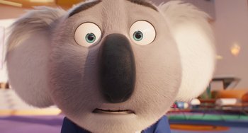 Movie still from “Sing 2” (2021), directed by Christophe Lourdelet – The face of a koala bear; Close Up shot, Over the shoulder angle