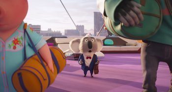 Movie still from “Sing 2” (2021), directed by Christophe Lourdelet – A koala is standing on a purple floor; Wide shot, Over the shoulder angle