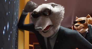 Movie still from “Sing 2” (2021), directed by Christophe Lourdelet – A man in a suit and tie wearing sunglasses; Close Up shot, Low angle