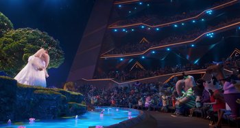 Movie still from “Sing 2” (2021), directed by Christophe Lourdelet – A crowd of people in a building at night; Extreme Wide shot, High angle