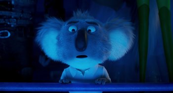 Movie still from “Sing 2” (2021), directed by Christophe Lourdelet – A blue koala is looking at the camera; Close Up shot, Low angle
