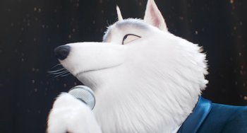 Movie still from “Sing 2” (2021), directed by Christophe Lourdelet – A dog's face with a microphone in front of it; Extreme Close Up shot, Low angle