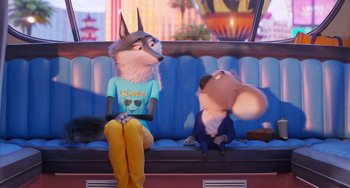 Movie still from “Sing 2” (2021), directed by Christophe Lourdelet – Two cartoon characters sitting on a bus seat; Medium shot, Over the shoulder angle