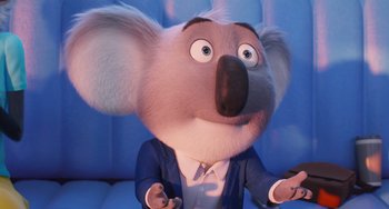 Movie still from “Sing 2” (2021), directed by Christophe Lourdelet – A cartoon koala is holding a cell phone in his hand; Close Up shot, Low angle