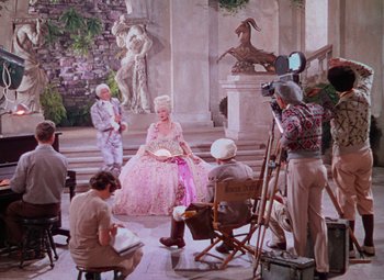 Movie still from “Singin' in the Rain” (1952), directed by Gene Kelly – A group of people sitting in a room; Wide shot, High angle
