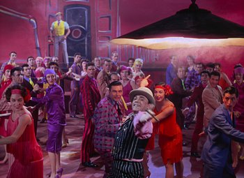 Movie still from “Singin' in the Rain” (1952), directed by Gene Kelly – A group of people standing in a room; Wide shot, High angle