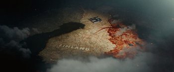 Movie still from “Sisu” (2022), directed by Jalmari Helander – A map of finland with a swastika on it; Extreme Wide shot, High angle