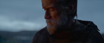 Movie still from “Sisu” (2022), directed by Jalmari Helander – An old man with a beard and a long beard; Close Up shot, Low angle