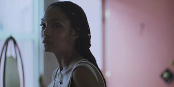 Movie still from “Sitting in Bars with Cake” (2023), directed by Trish Sie – A person wearing a white shirt; Close Up shot, Low angle
