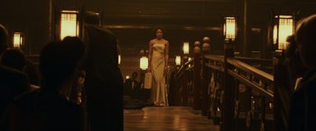 Movie still from “Skyfall” (2012), directed by Sam Mendes – A woman in an evening gown standing on a wooden floor; Wide shot, Low angle