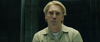 Movie still from “Skyfall” (2012), directed by Sam Mendes – A person wearing a tan shirt; Close Up shot, Low angle