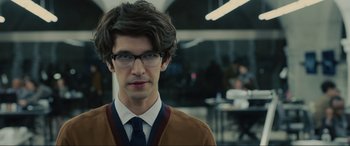 Movie still from “Skyfall” (2012), directed by Sam Mendes – A young man with glasses and a tie; Close Up shot, Over the shoulder angle