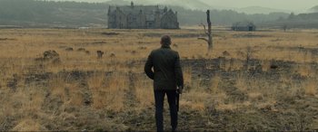 Movie still from “Skyfall” (2012), directed by Sam Mendes – A man standing in the middle of an open field; Wide shot, Low angle