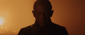 Movie still from “Skyfall” (2012), directed by Sam Mendes – A man with his head turned to the side; Close Up shot, Low angle