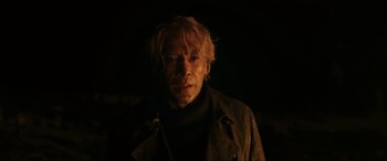 Movie still from “Skyfall” (2012), directed by Sam Mendes – A man with blonde hair wearing a black jacket; Close Up shot, Over the shoulder angle