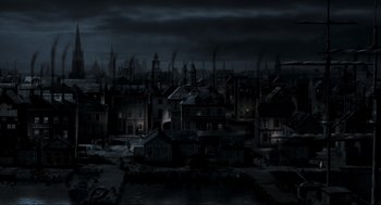 Movie still from “Sleepy Hollow” (1999), directed by Tim Burton – A dark city is lit up at night time; Extreme Wide shot, High angle