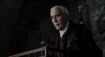 Movie still from “Sleepy Hollow” (1999), directed by Tim Burton – An older man in a leather jacket looking at the camera; Medium shot, Low angle