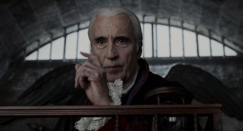 Movie still from “Sleepy Hollow” (1999), directed by Tim Burton – An old man with a white beard and a white wig; Close Up shot, Over the shoulder angle