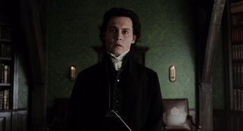 Movie still from “Sleepy Hollow” (1999), directed by Tim Burton – A man standing in front of a green wall; Medium shot, Low angle